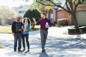 realtor showing neighborhood good for building a custom home